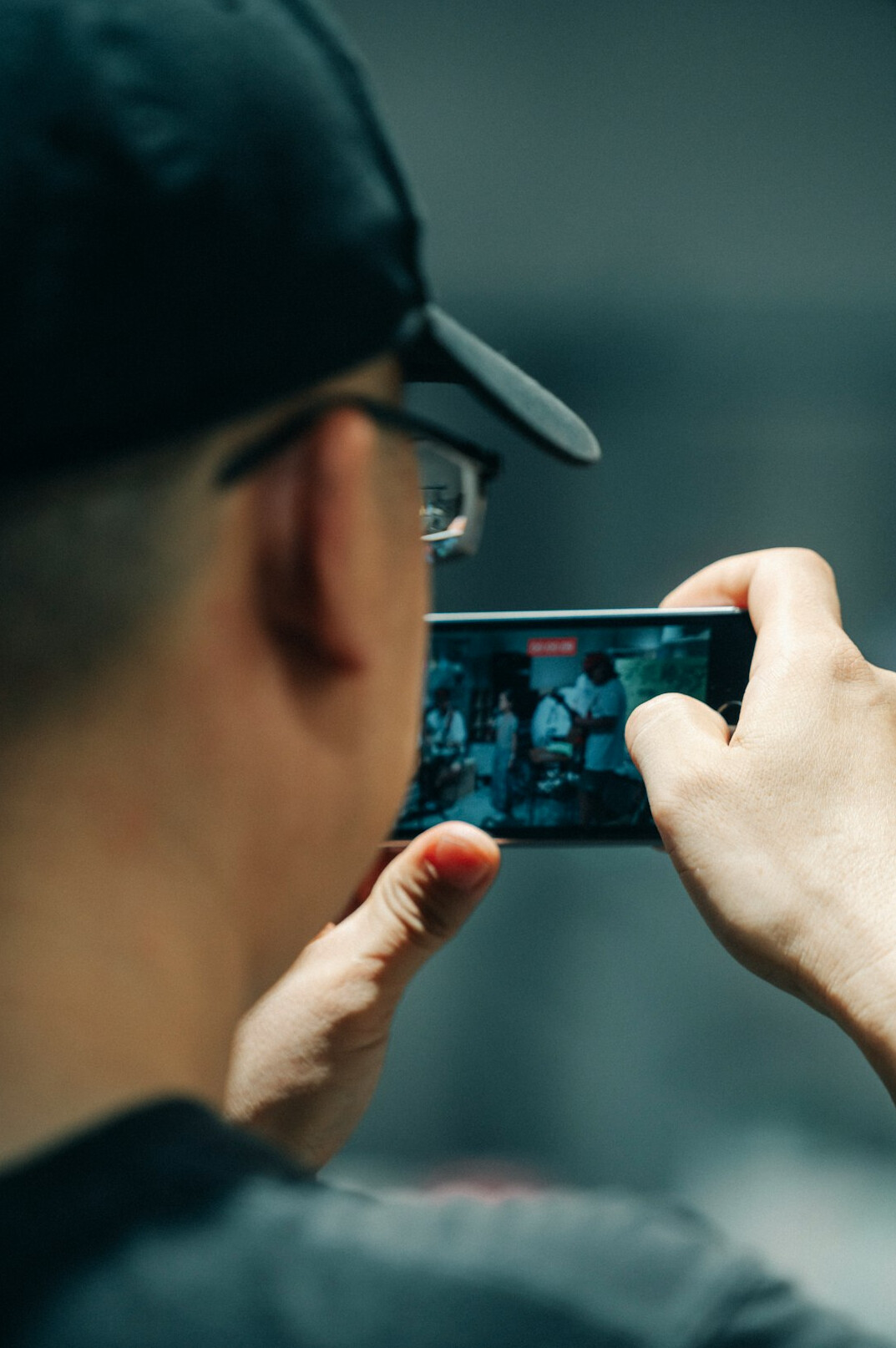 Video operator watching multiple live video feeds on screens